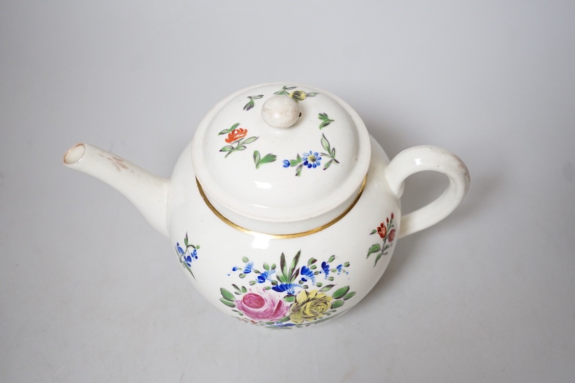 An 18th century Caughley teapot and cover with back to back roses, 15cms high including cover